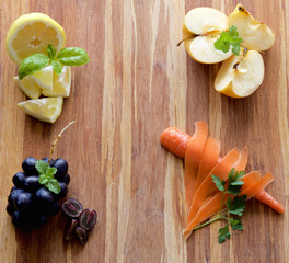 Fruits, vegetables and herbs on wood cutting board