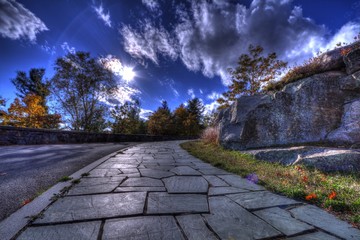 Surreal view from stone sidewalk on summer day