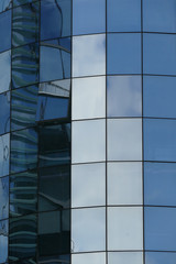  Reflection in windows of modern office building