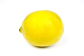 A bright fresh yellow lemon on a white studio background