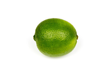 A fresh ripe shiny green lime on a white studio background