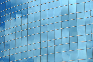 Fototapeta premium Reflection in windows of modern office building