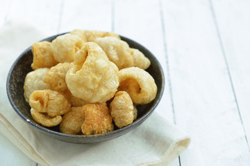 Pork rinds also known as chicharon or chicharrones, deep fried p