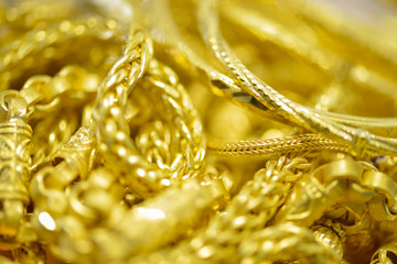 Gold necklaces , bracelets ,Blured and bokeh for gold background