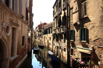 Obraz na płótnie Canvas among old colorful brick houses in Venice, Italy.