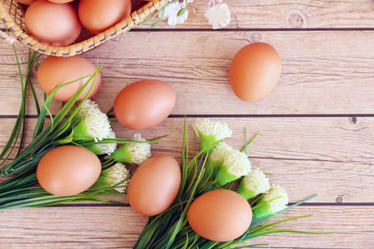Eggs in the basket on wooden background