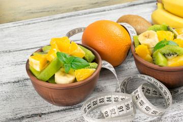 Fruit salad with kiwi, banana and orange and centimeter