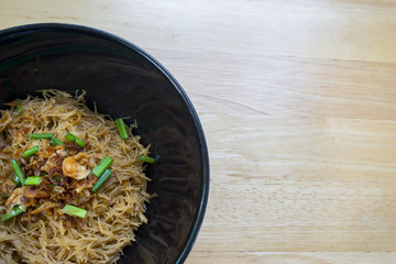 Thai- style noodles and fried garlic,leeks with Pork bone soup f