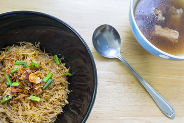 Thai- style noodles and fried garlic,leeks with Pork bone soup f