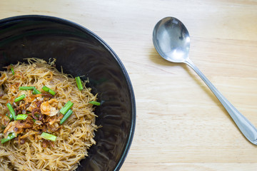 Thai- style noodles and fried garlic,leeks with Pork bone soup f