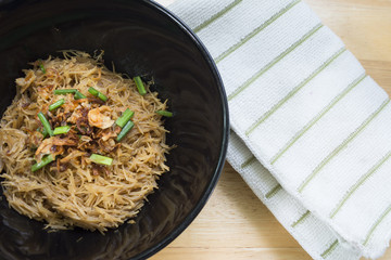 Thai- style noodles and fried garlic,leeks with Pork bone soup f