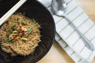 Thai- style noodles and fried garlic,leeks with Pork bone soup f