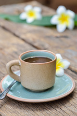 Coffee  cup mug on old wooden table with nature light