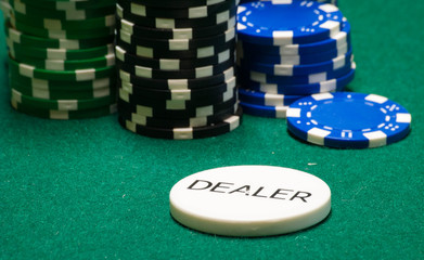Dealer Chip On Green Felt Playing Surface