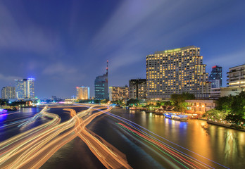 Fototapeta na wymiar Beautiful night city bangkok with speed light on river