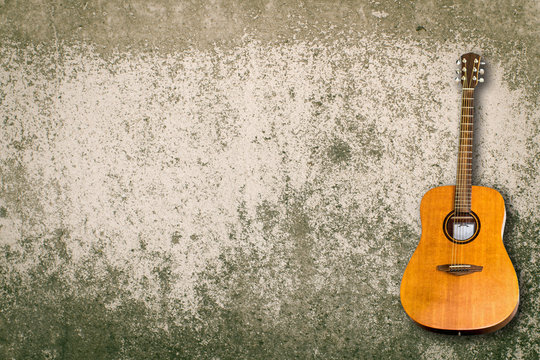 Acoustic Guitar and blank grunge background