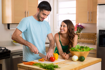 Young fit lovers making health food for lunch and dinner to keep in shape
