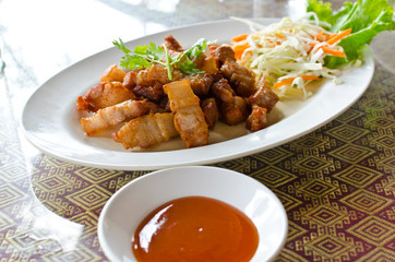 Fried pork belly with fish sauce, Thai recipe.