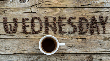 Cup of coffee on wooden background