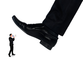 Feet man crushing little business man