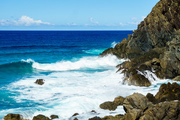 Waves on the Rocks at the base of a cliff in Australia