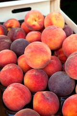 Fresh peaches selling in a market