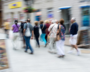Busy city people going along the street