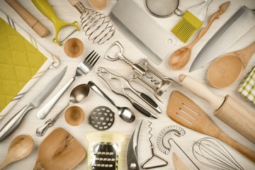 Kitchen utensils set on wooden texture background