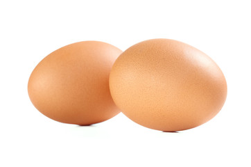 Two Brown Chicken Eggs Isolated on White Background.