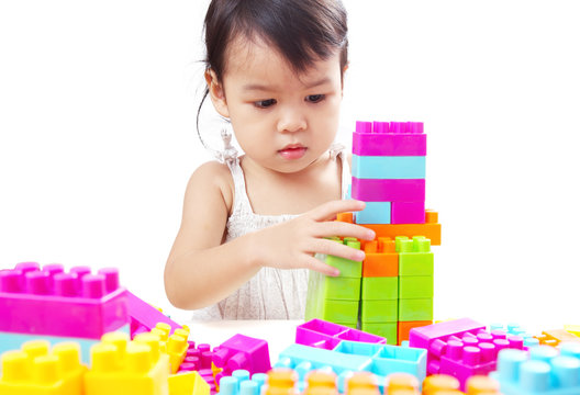 Asian Baby Girl, Toddler, Playing Colorful Blocks Isolated on White Background.