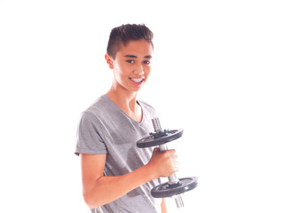 teenage boy exercising with dumbbells