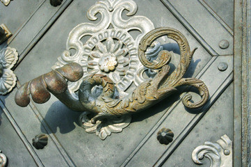 Old metal door knocker closeup
