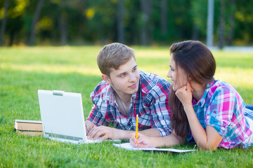 Young teen couple with laptop computer