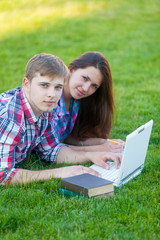 Young teen couple with laptop computer
