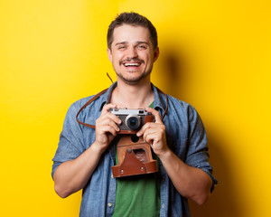 guy in shirt with vintage camera