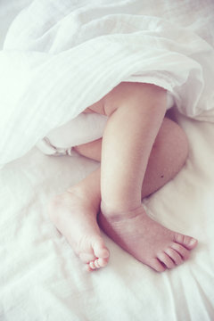 Soft focus and blurry of Baby Feet, vintage style color effect