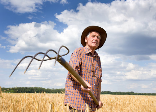 Farmer with hayfork
