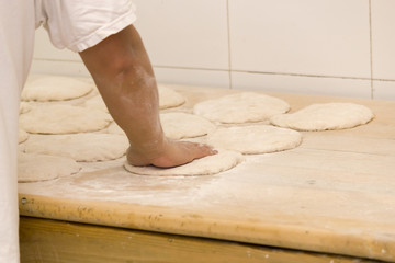 Baker preparing dough