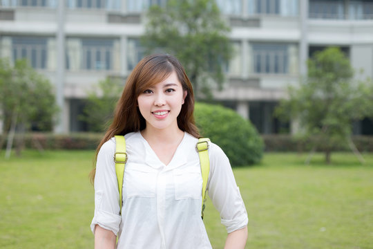 Asian beautiful female student portrait in campus