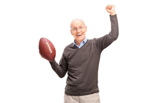 Joyful Senior Man Holding An American Football