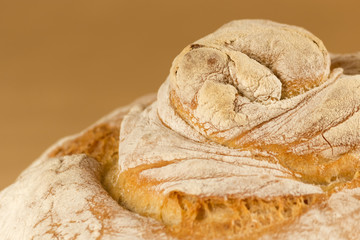 Closeup to traditional bread on golden background