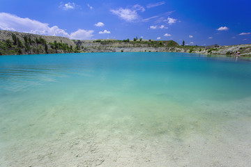 Obraz na płótnie Canvas Flooded stone quarry. Crimea. Skalistoe village, Bakhchisaray region. Lake in quarry.