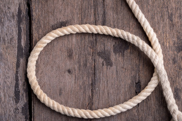 Obraz premium rope on a wood desk