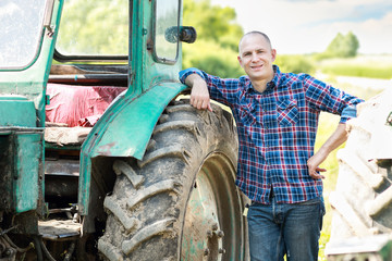 farmer driving tractor in  countryside © JENOCHE