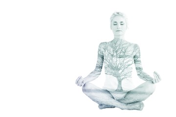 Composite image of toned young woman sitting in lotus pose