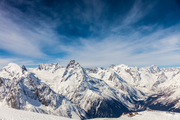 Snowy peaks against the blue sky