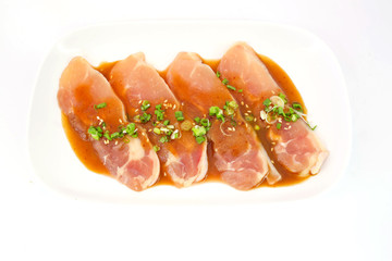 Fresh slices of chicken isoloate on white background ready to be