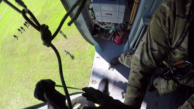 Downhill on a rope from a helicopter.