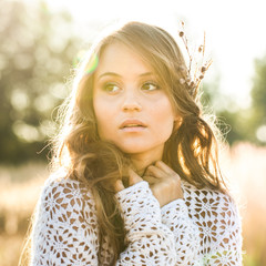 Beautiful young lady model in field at sunrise - outdoors shot