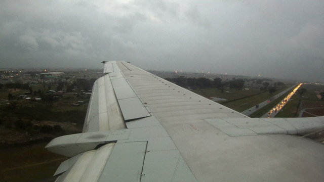 Shot over an airplane's wing as it is about to land